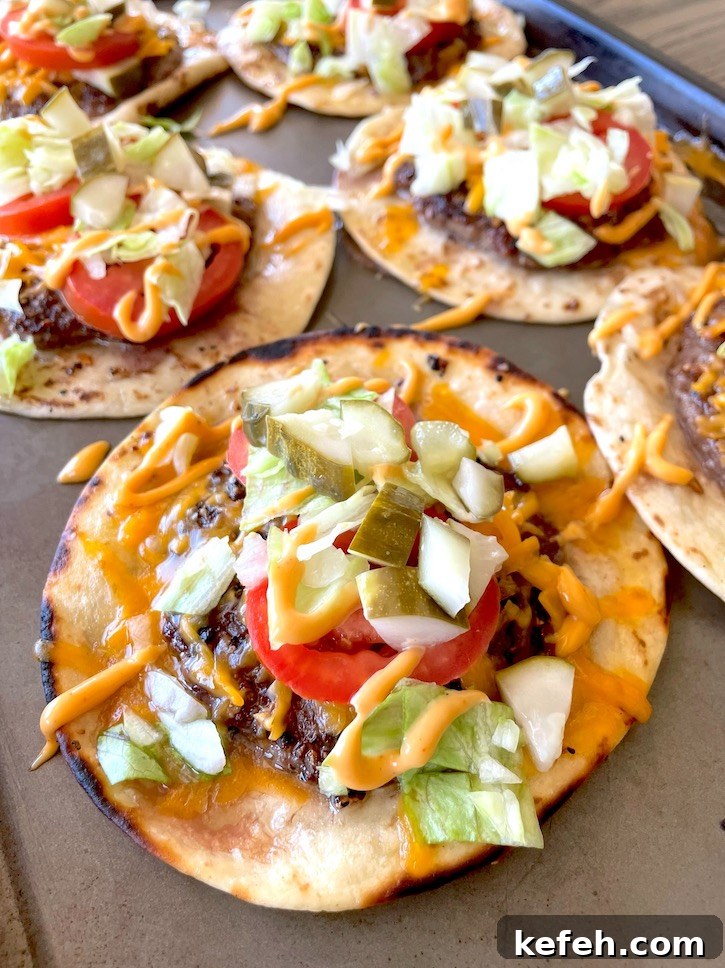 Bic Mac Smashed Burger Tacos are a fun ground beef dinner recipe made with flour tortillas and cheese, and then loaded with classic burger condiments. 