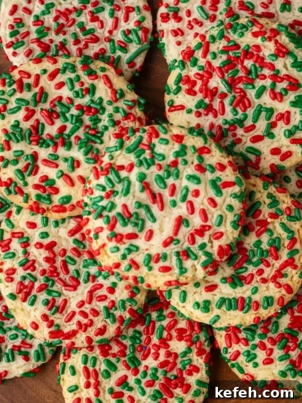 Chewy Cowboy Cookies with Oats, Chocolate & Pecans 15 picture of sprinkle cookies on a wood platter