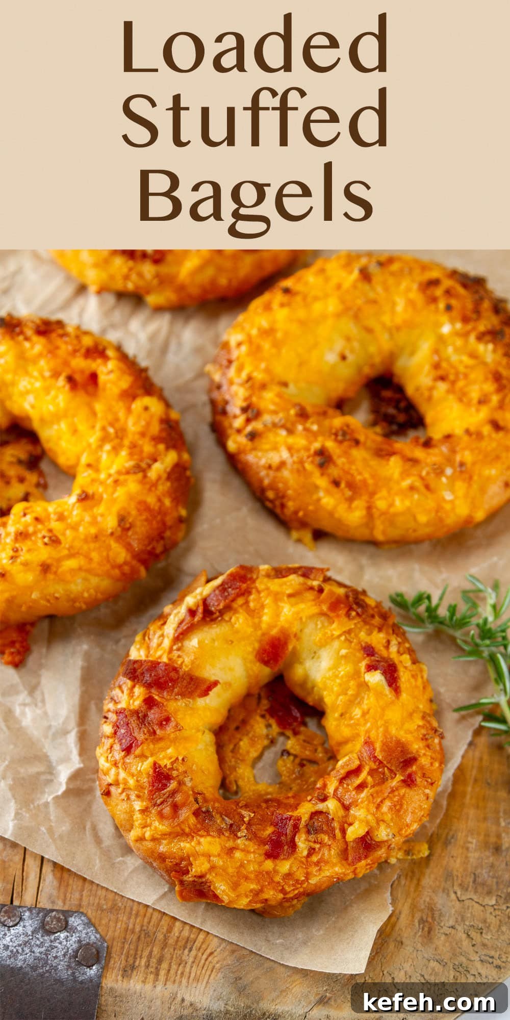 Loaded Stuffed Bagel Recipes: Creative Fillings and Toppings 12 looking down on some bagels on a piece of parchment paper with some rosemary.