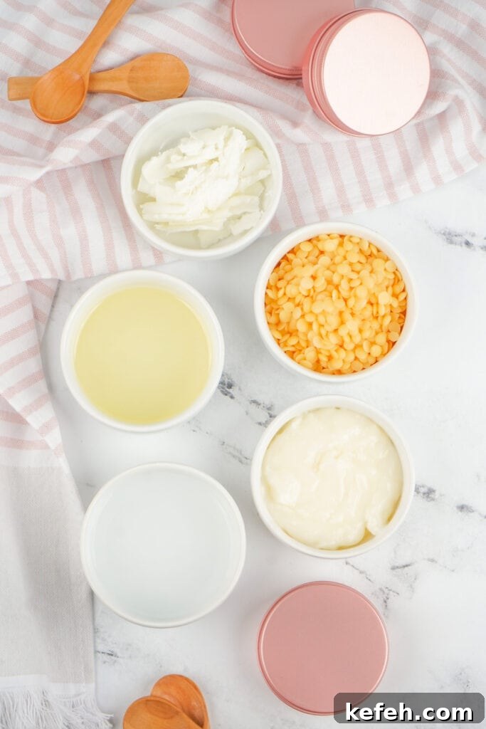 Ingredients for dog paw balm arranged in small white bowls with wooden spoons and pink metal tins.