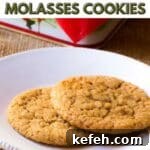 Two ginger molasses cookies on a plate with text overlay.