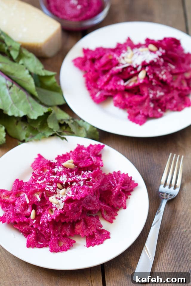 Creamy Beet Pesto Pasta with Goat Cheese and Walnuts 5 beet pesto pasta on a white plate
