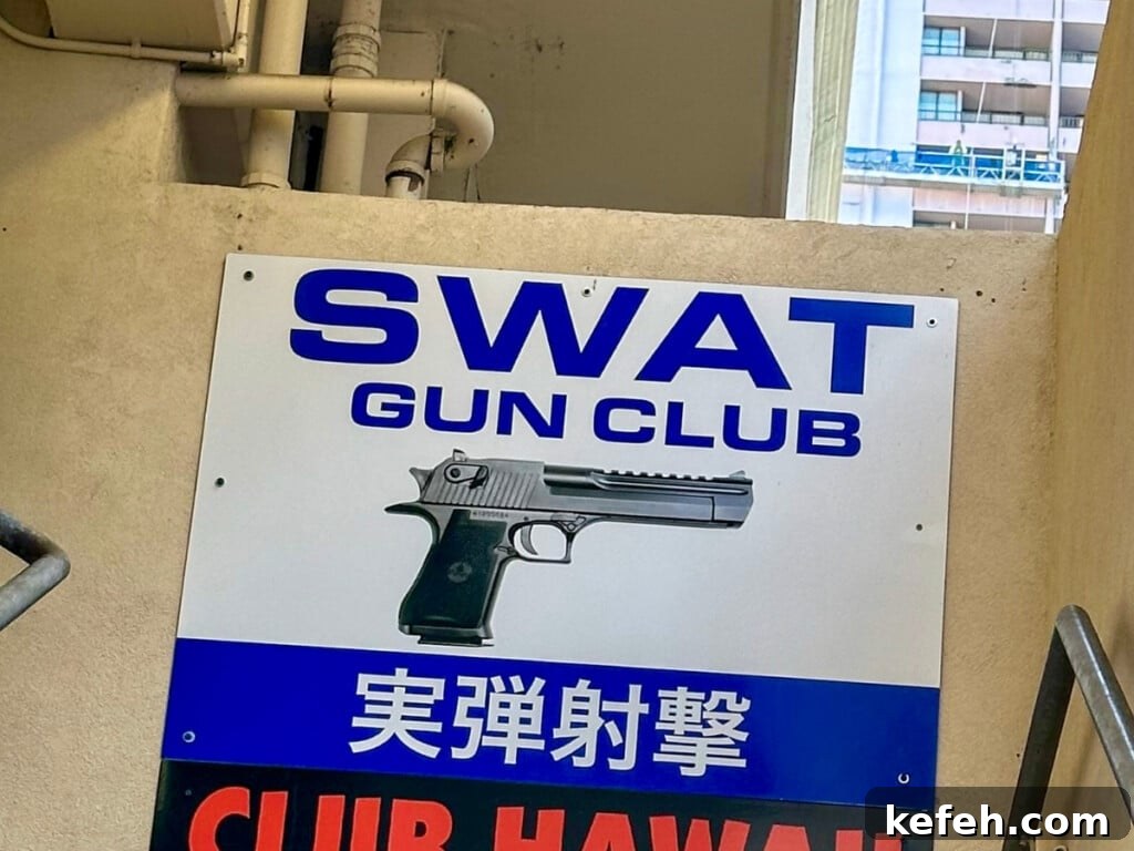 100+ Waikīkī Activities: Local Favorites and Insider Tips 11 SWAT Gun Club sign.