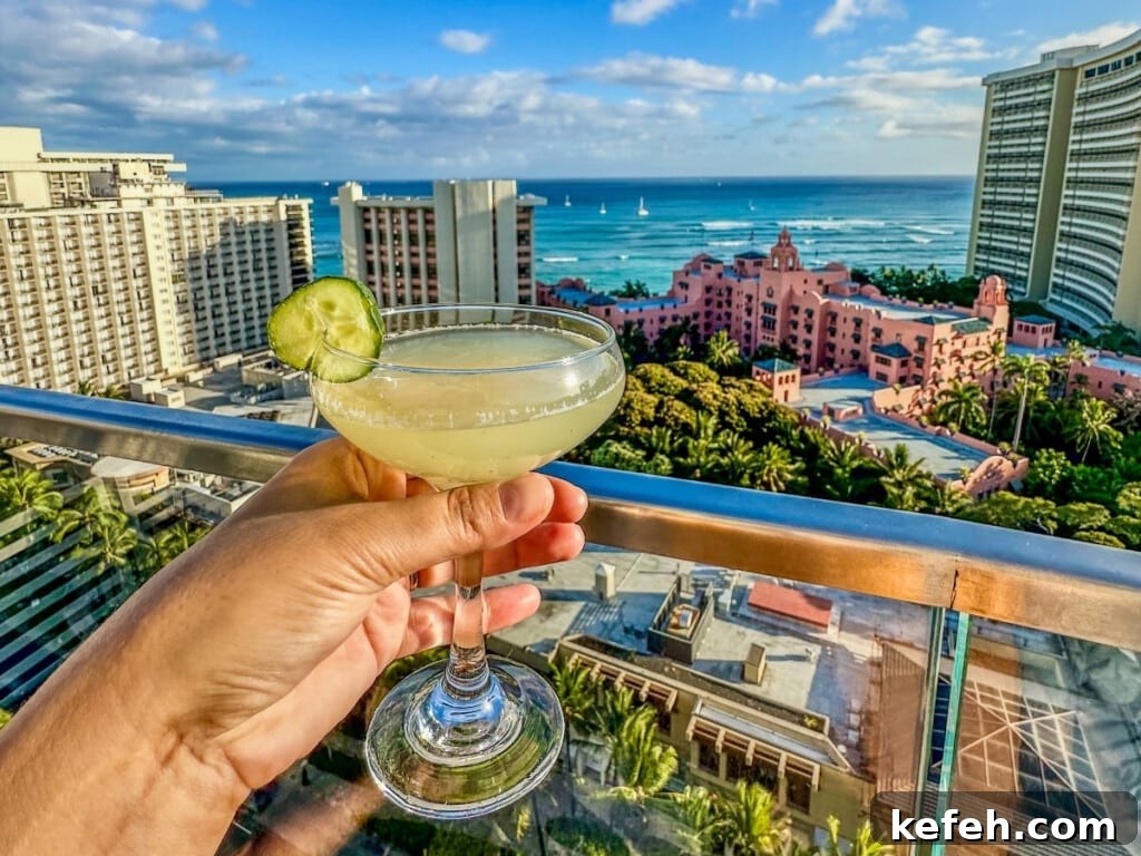 100+ Waikīkī Activities: Local Favorites and Insider Tips 9 Cocktail with a view of the ocean and Waikīkī skyline at SKY Waikiki.