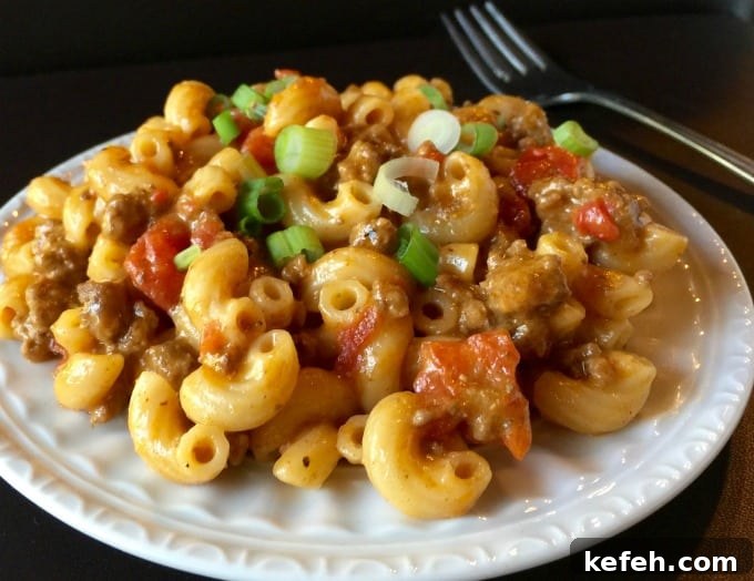 white plate with skinny cheeseburger pasta skillet