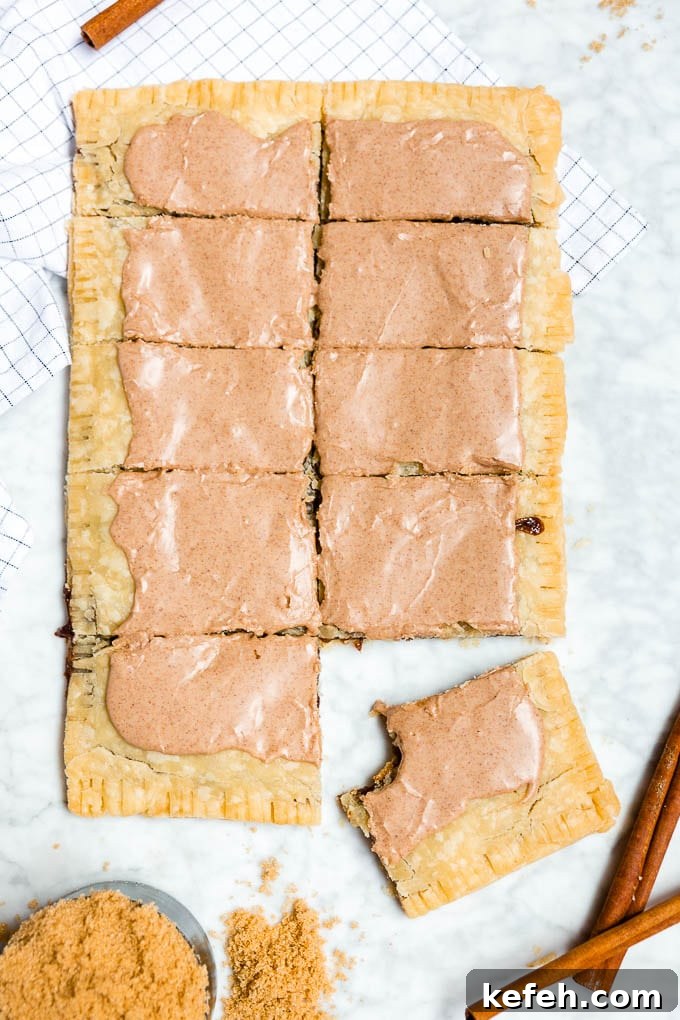 A giant brown sugar cinnamon pop tart sliced into ten pieces.