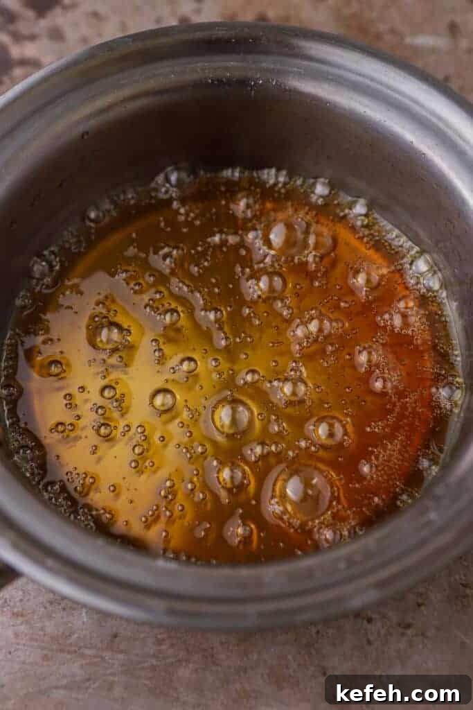 Homemade Caramel Coffee Syrup Recipe for Café-Quality Drinks 5 Bubbling caramel in a pan