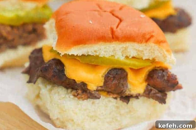 30 Ground Beef Dinner Recipes for Quick Family Meals 21 closeup of the Cheeseburger Sliders served on a wooden board.