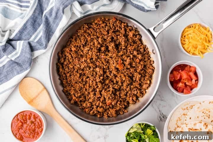 30 Ground Beef Dinner Recipes for Quick Family Meals 22 top-down view of the ground beef for tacos in the pan.