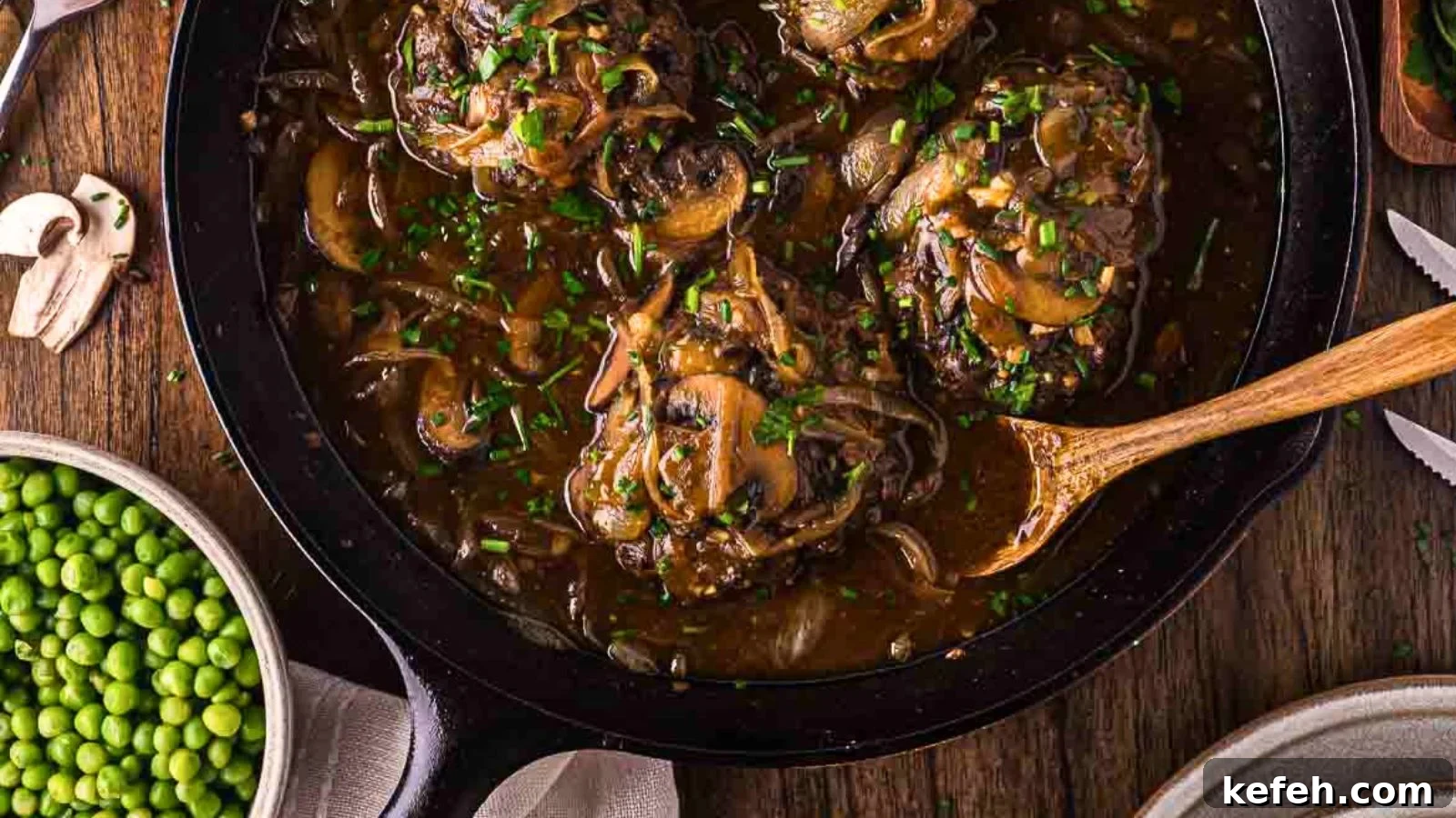 17 Budget-Friendly Steak Recipes to Feed a Crowd Without Breaking the Bank 8 Ground beef patties served with mushroom gravy.