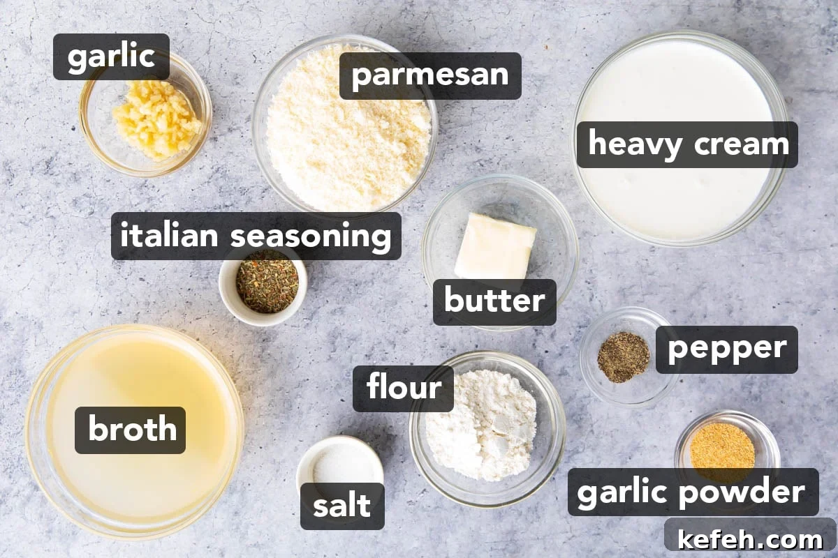 Garlic parmesan sauce ingredients in prep bowls, including parmesan, heavy cream, butter, chicken broth, Italian seasoning, black pepper, salt, minced garlic, and garlic powder.