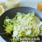 Caesar salad in bowl with fork.