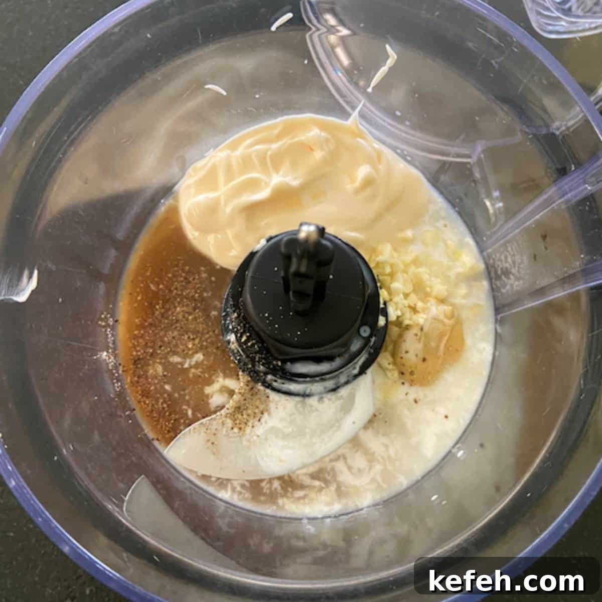 Creamy Caesar Salad Dressing Without Anchovies or Raw Eggs 4 Caesar salad ingredients in food processor.