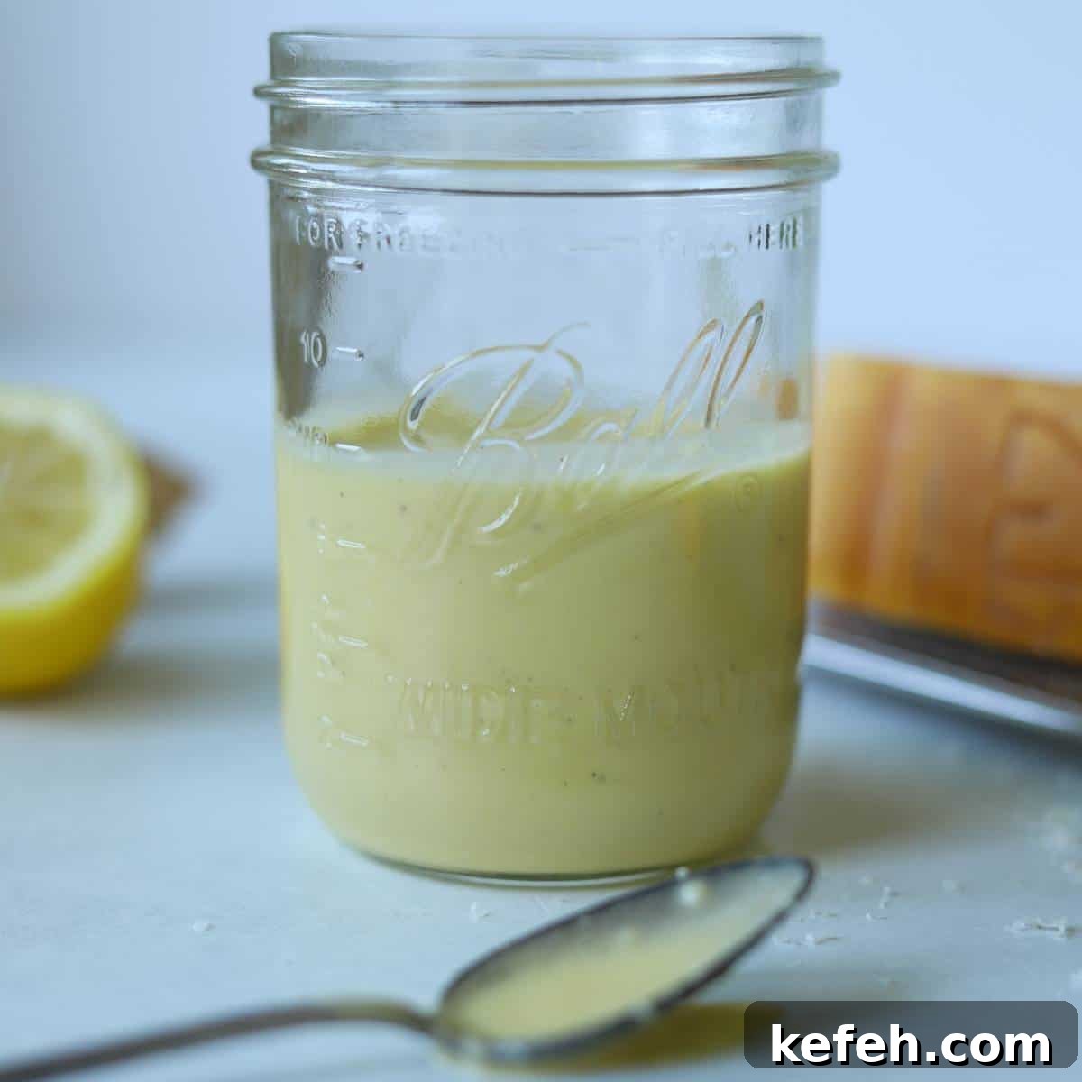 Creamy Caesar Salad Dressing Without Anchovies or Raw Eggs 8 Mason jar full of caesar dressing.