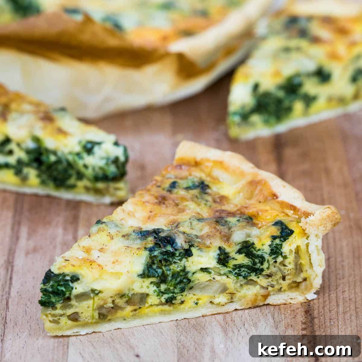 slice of Quiche Florentine with other slices in background