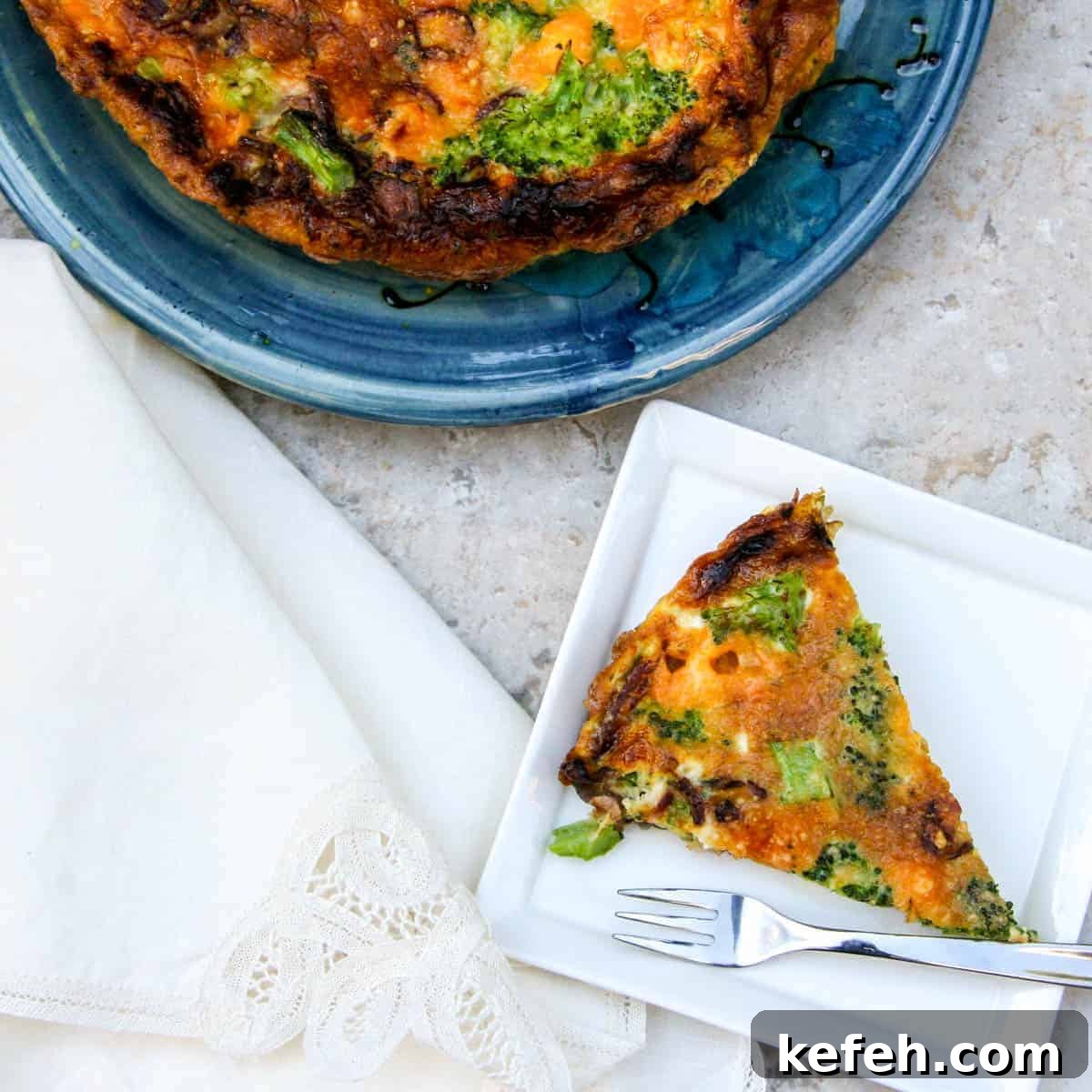 bacon, broccoli, and cheddar frittata slice on small plate with whole frittata in background