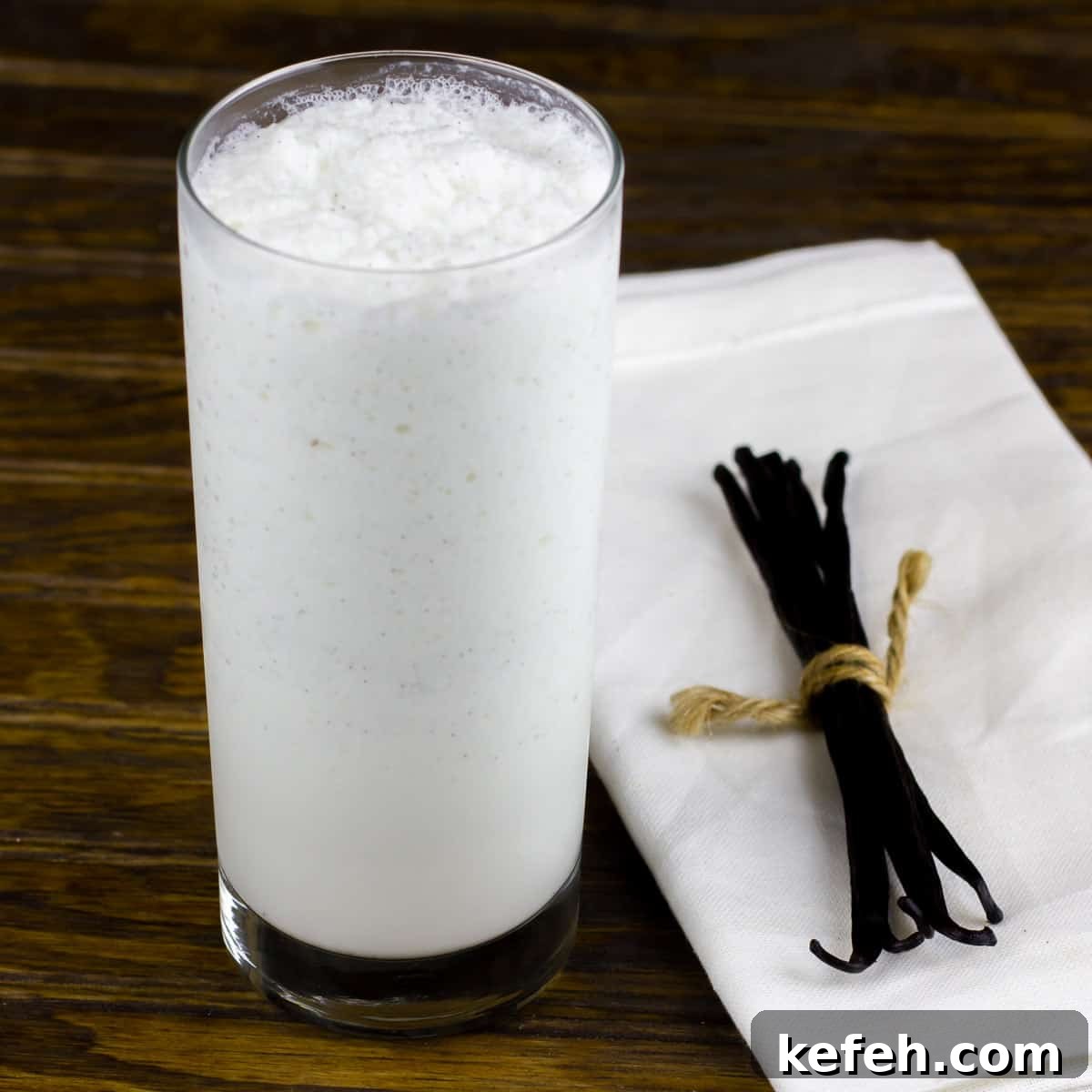 Creamy Vanilla Bean Frappé Recipe for Iced Coffee Lovers 2 A tall glass of frozen frappucino.
