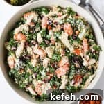 Chicken, broccoli and kale salad served in a bowl.