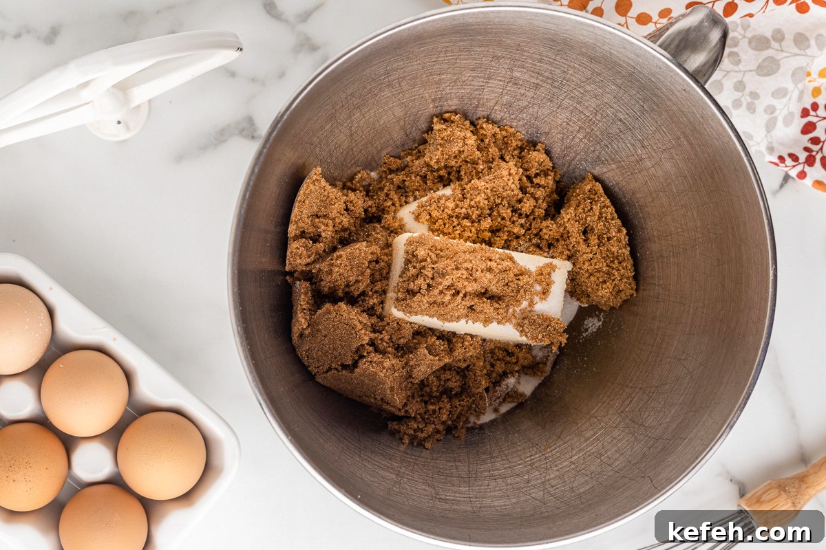 Butter and brown sugar in a mixing bowl.
