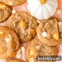 white chocolate pumpkin spice cookies on pink table