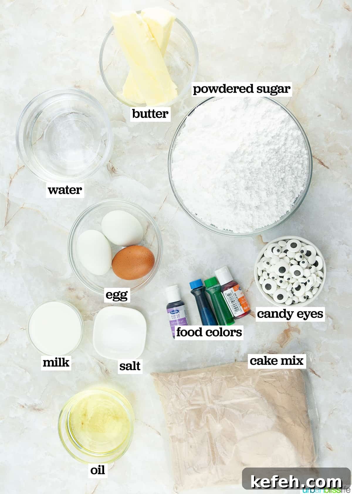 several bowls of ingredients to make Halloween monster cupcakes.