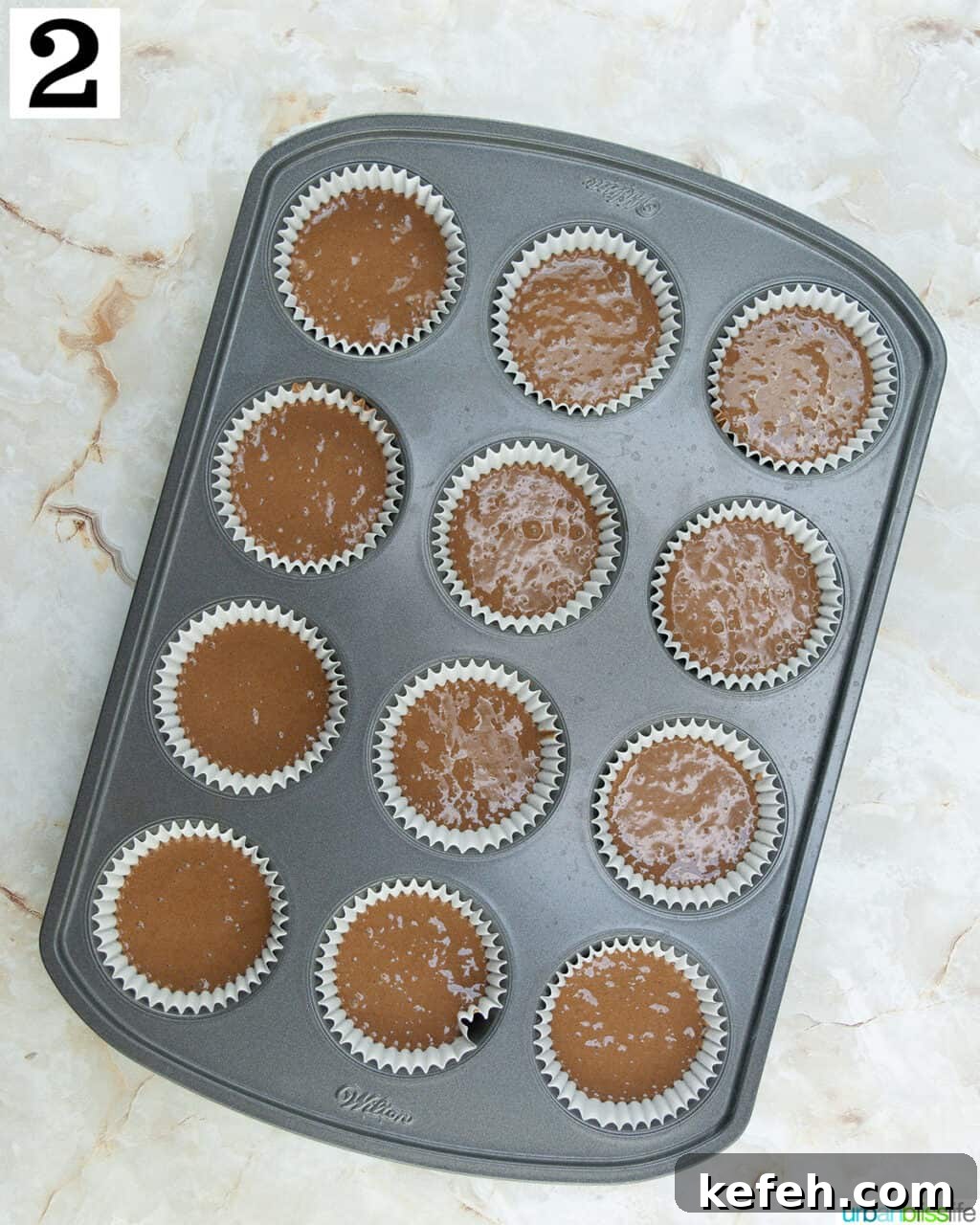chocolate cake mix in a cupcake tin.
