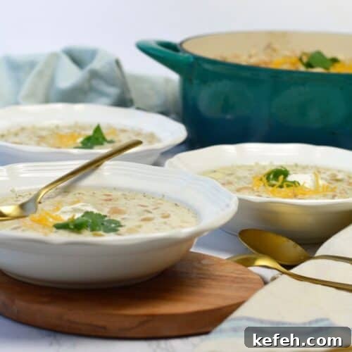 3 white bowls of white bean chicken chili.