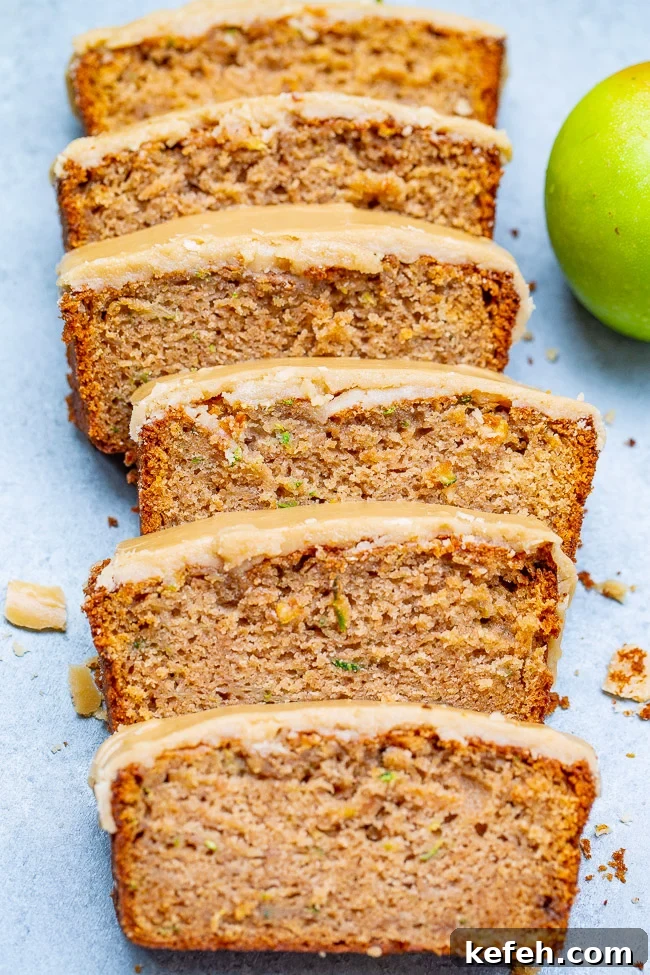 Apple Zucchini Bread with Brown Sugar Frosting sliced into pieces. 