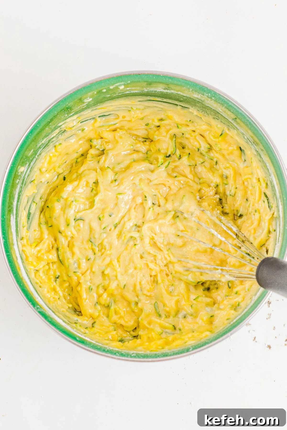 Lemon zucchini bread batter in a bowl. 