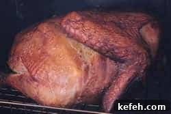 Smoked Turkey Topped with Bacon Butter 13 Thermometer reading 150°F