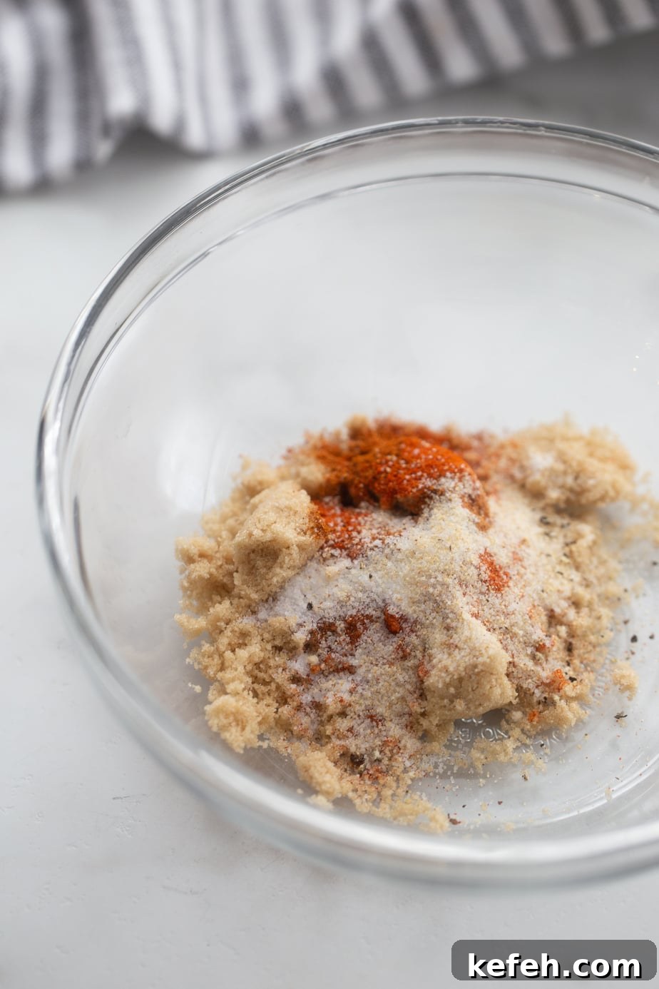 Crispy Air Fryer Pork Tenderloin with Garlic Herb Rub 4 Spice blend for pork tenderloin in a glass bowl, not mixed.