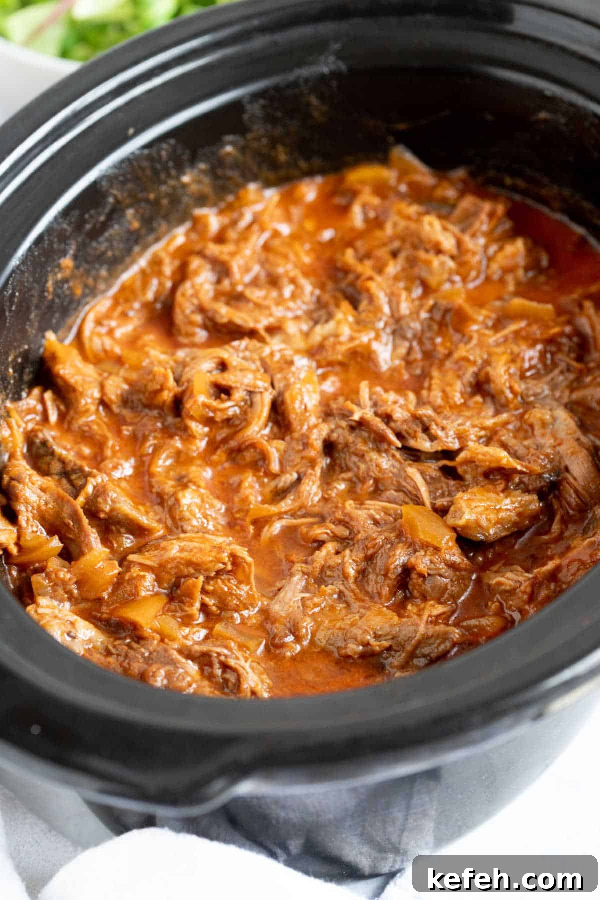 Slow Cooker Pulled Beef Recipe for Tender, Shredded Meat 6 BBQ shredded beef in a slow cooker.