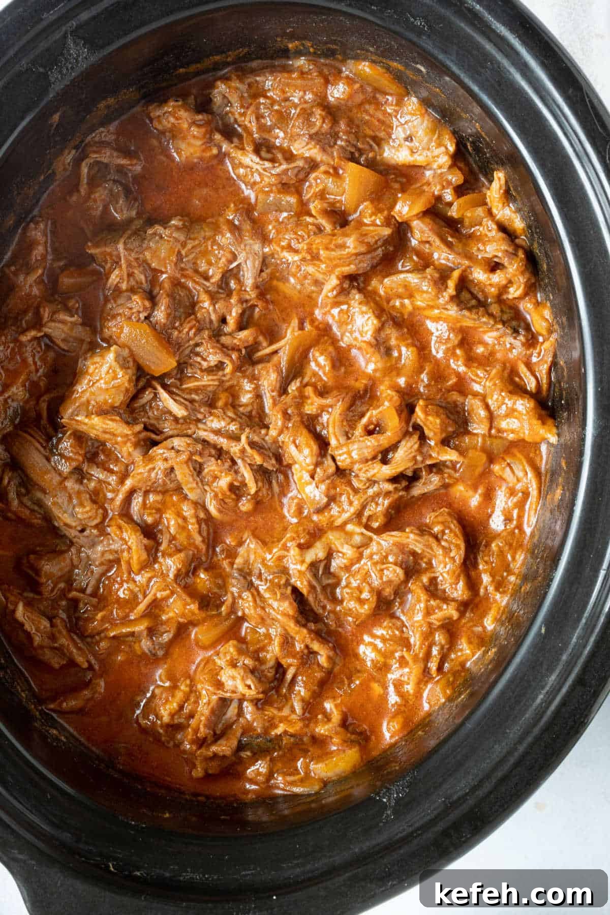 Slow Cooker Pulled Beef Recipe for Tender, Shredded Meat 7 Pulled bbq beef brisket in slow cooker.