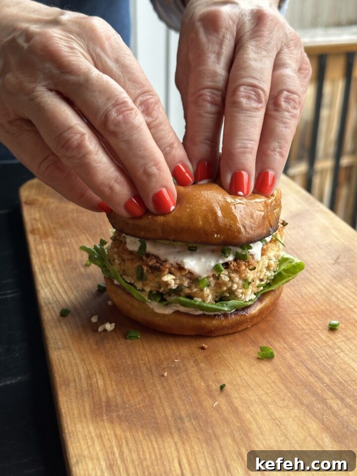 Middle Eastern Salmon Burger Recipe with Zaatar and Tahini 14 assembling burger