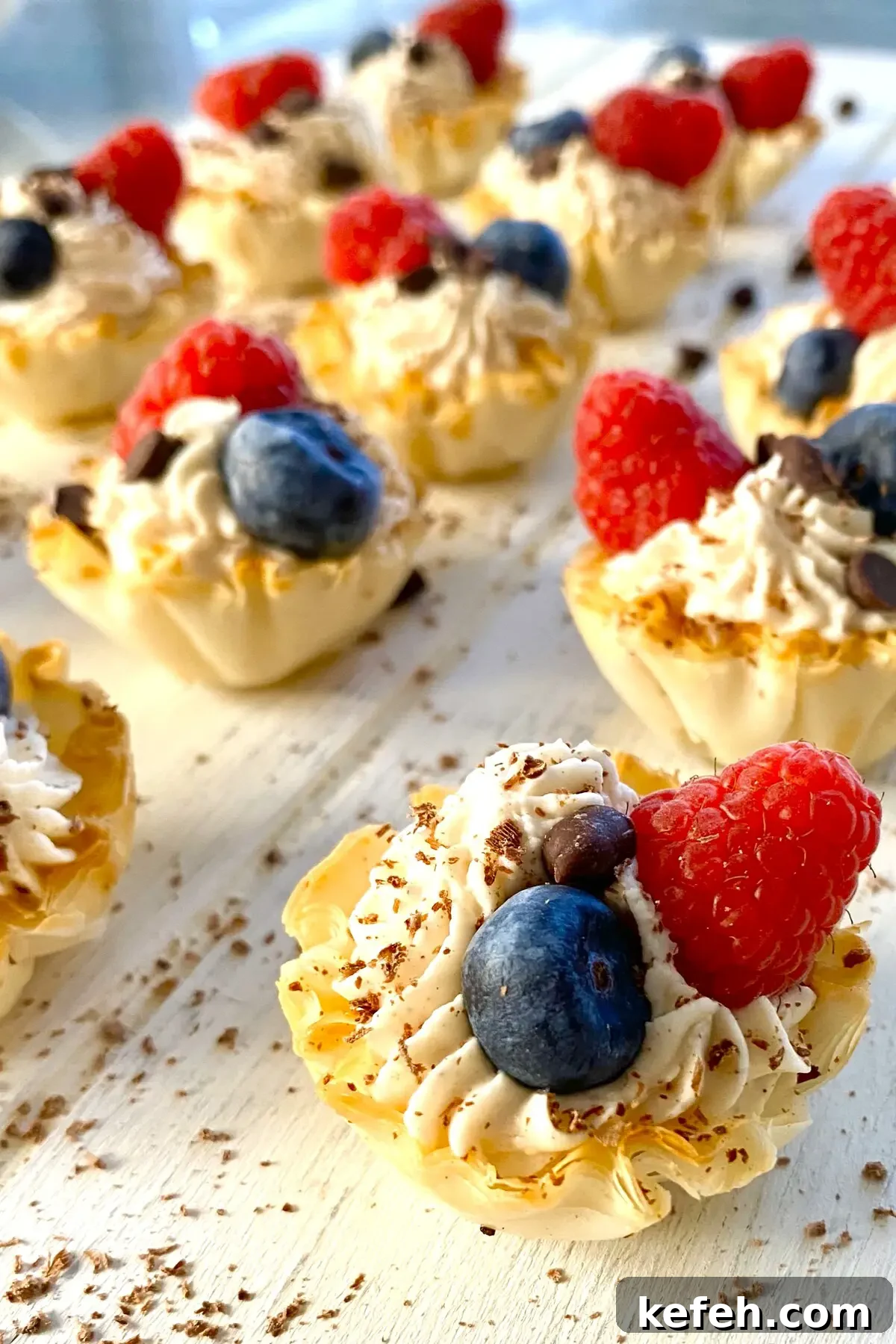 Mini No-Bake Philadelphia Cheesecakes Recipe 2 Mini Philadelphia no bake cheesecake recipe served in phyllo cups and topped with berries.
