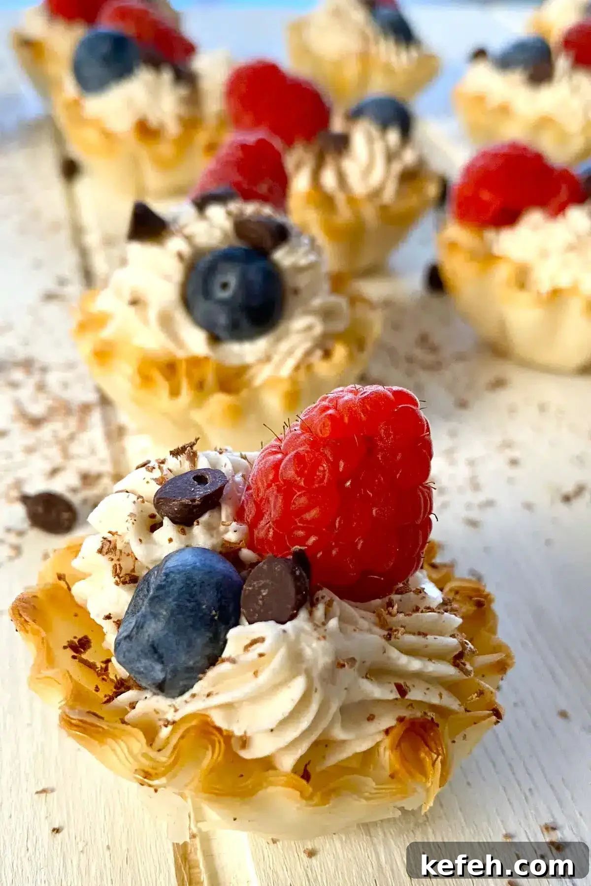 Mini No-Bake Philadelphia Cheesecakes Recipe 12 1 mini Philadelphia cheesecake topped with berries.