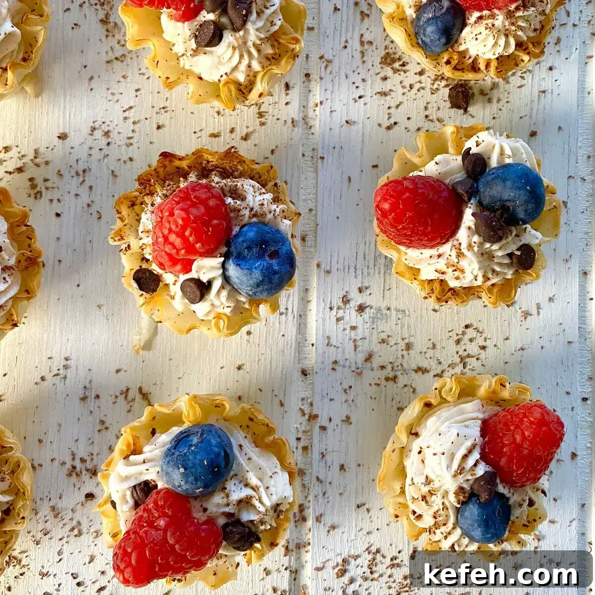 Mini No-Bake Philadelphia Cheesecakes Recipe 14 mini no bake cheesecakes with blueberries and raspberries.