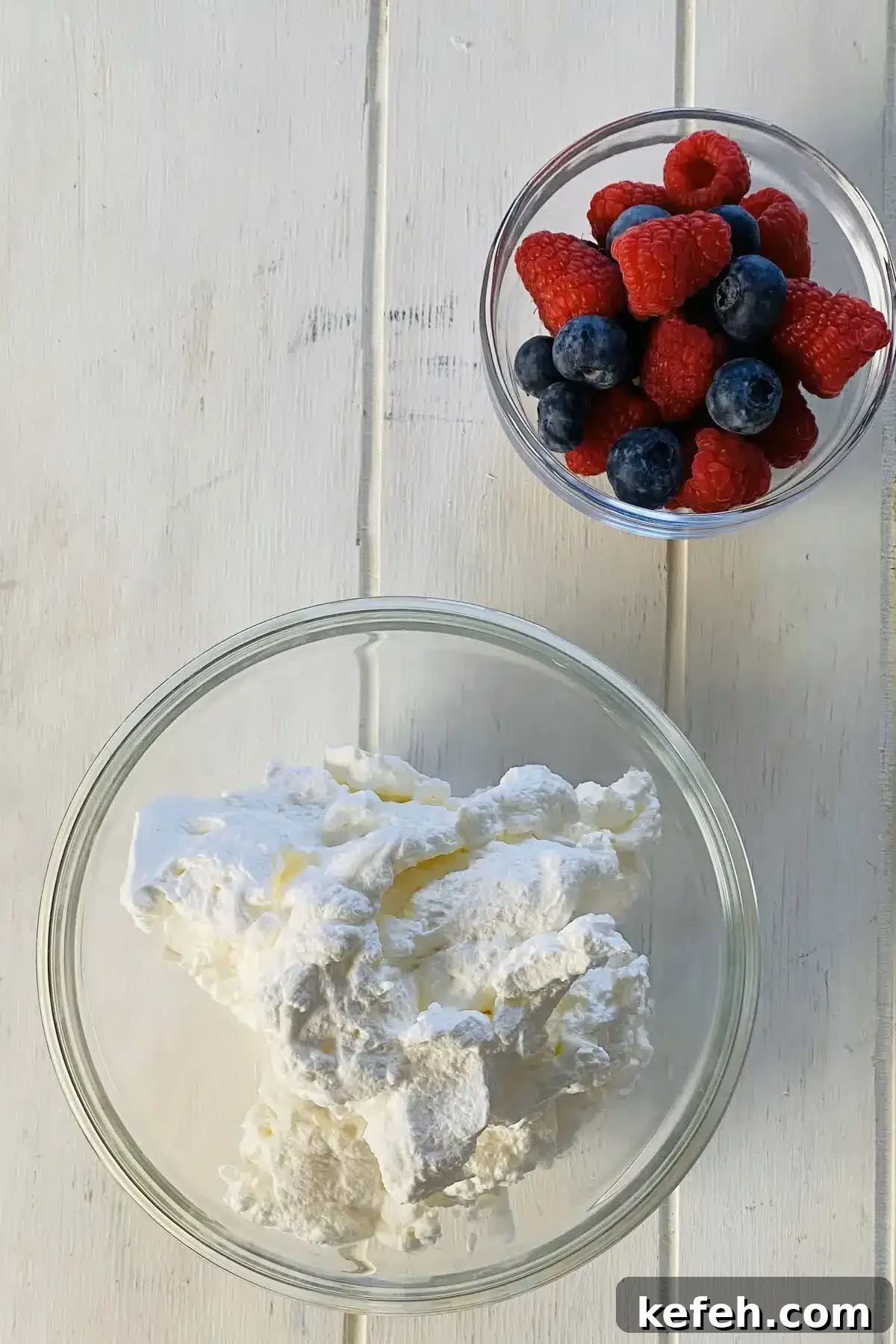 Mini No-Bake Philadelphia Cheesecakes Recipe 5 Homemade whipped cream and berries.