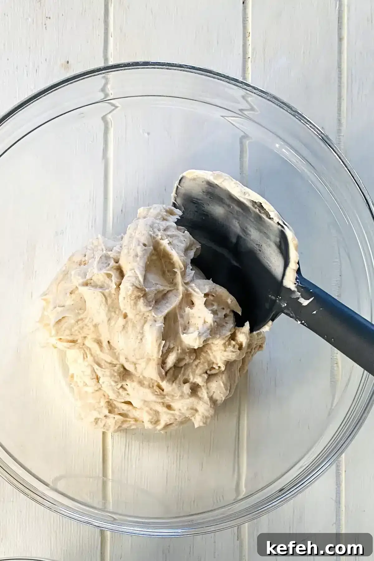 Mini No-Bake Philadelphia Cheesecakes Recipe 6 No bake cheesecake filling in a bowl with a spatula.