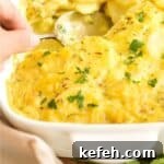 Scooping into scalloped potatoes.