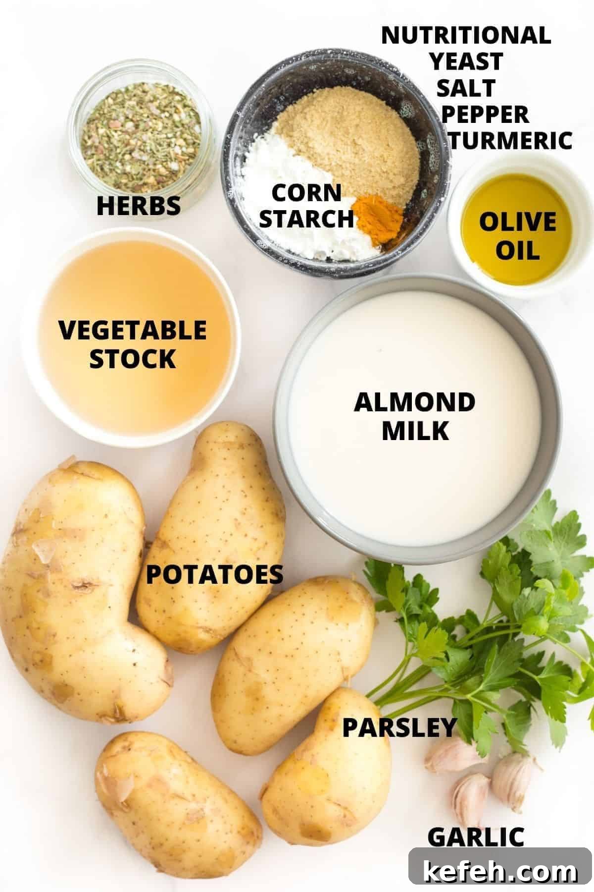 Gluten-Free Scalloped Potatoes Recipe (Dairy-Free, Vegan) Top down view of ingredients for scalloped potatoes recipe laid out on marble board.