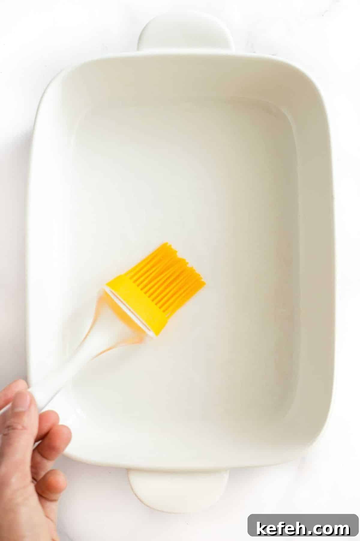Gluten and Dairy Free Potato Bake (Vegan) Using silicon brush to grease casserole dish.