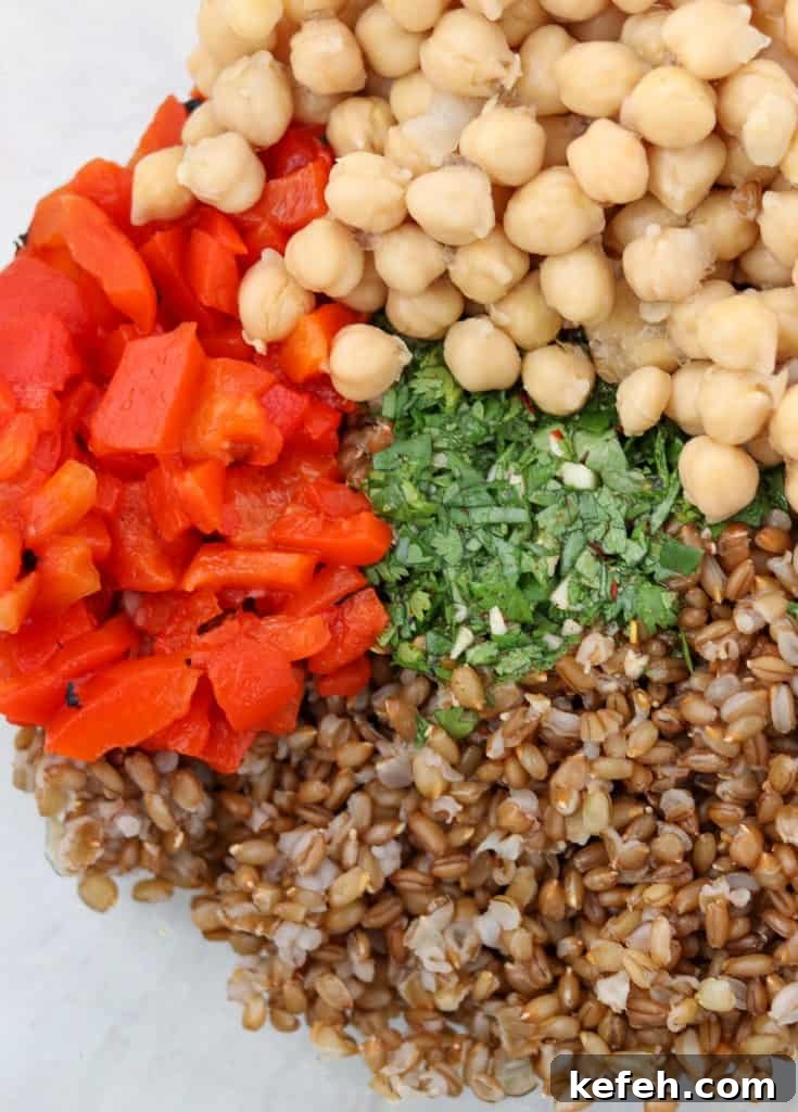 Rye Berry Salad with Chickpeas, Roasted Red Peppers and Arugula 4 rye berries, red peppers, chickpeas and herbs in a bowl