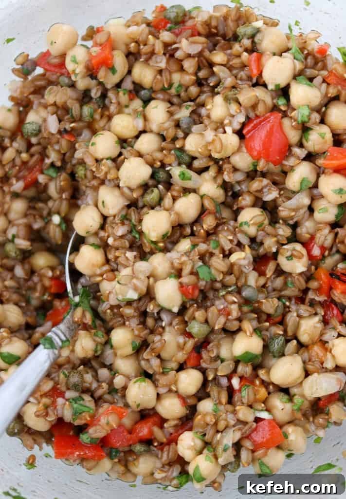 Rye Berry Salad with Chickpeas, Roasted Red Peppers and Arugula 5 rye berries, chickpeas and roasted red peppers tossed together in a bowl with a spoon