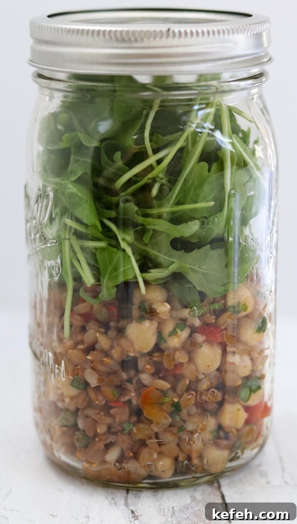Rye Berry Salad with Chickpeas, Roasted Red Peppers and Arugula 7 Rye berry salad and arugula leaves in a jar