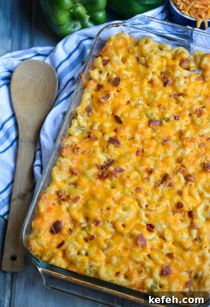 Creamy Pimento Cheese Macaroni and Cheese 3 a casserole dish filled with baked pimento cheese macaorni & cheese topped with crisp bacon bits