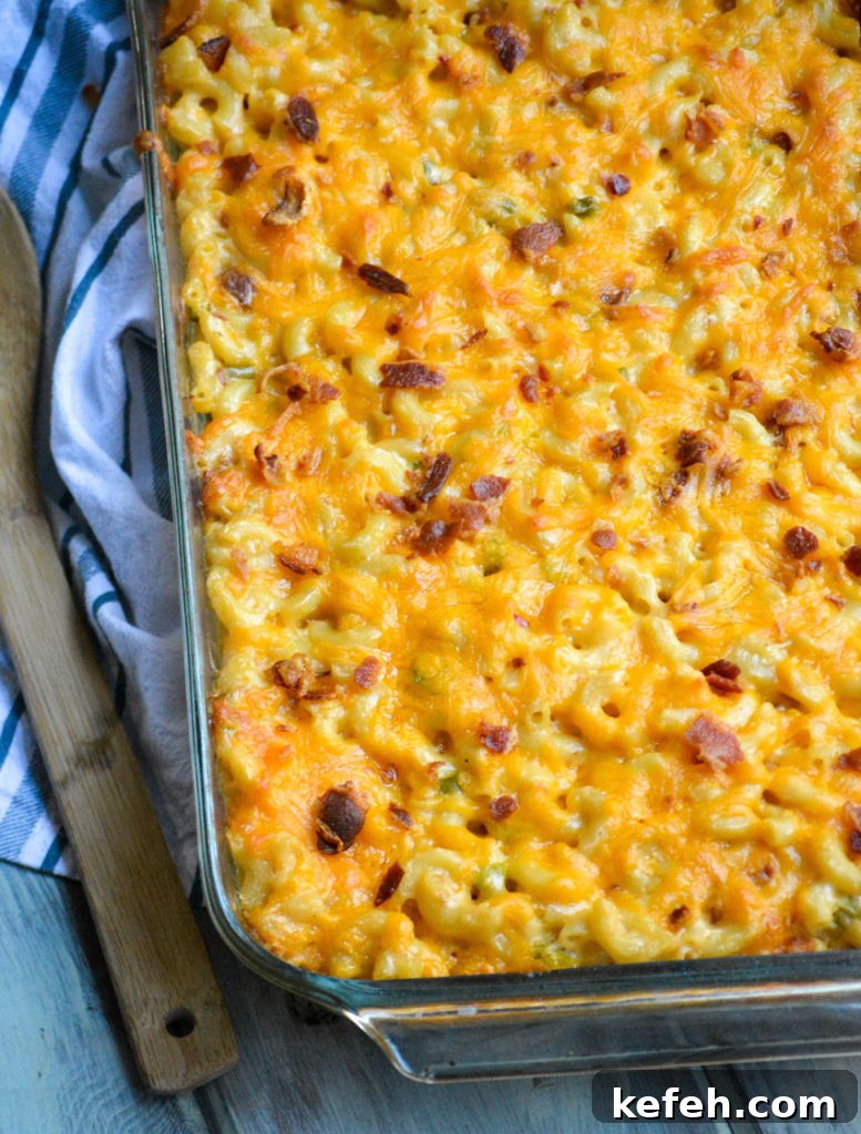 Creamy Pimento Cheese Macaroni and Cheese 4 a casserole dish filled with baked pimento cheese macaorni & cheese topped with crisp bacon bits