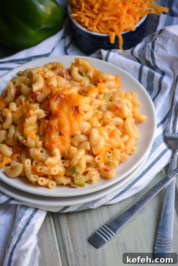 Creamy Pimento Cheese Macaroni and Cheese 6 pimento cheese macaroni & cheese served on a white plate