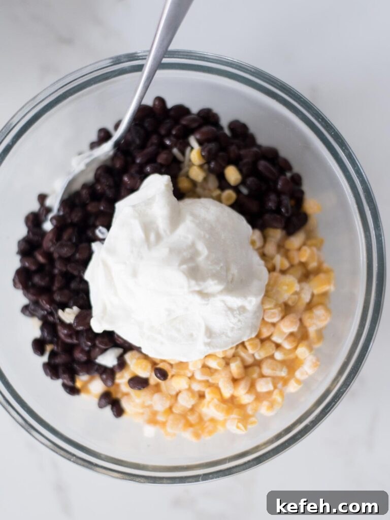 Tex Mex Chicken with Black Beans and Rice Casserole 7 Sour cream added over the black beans.
