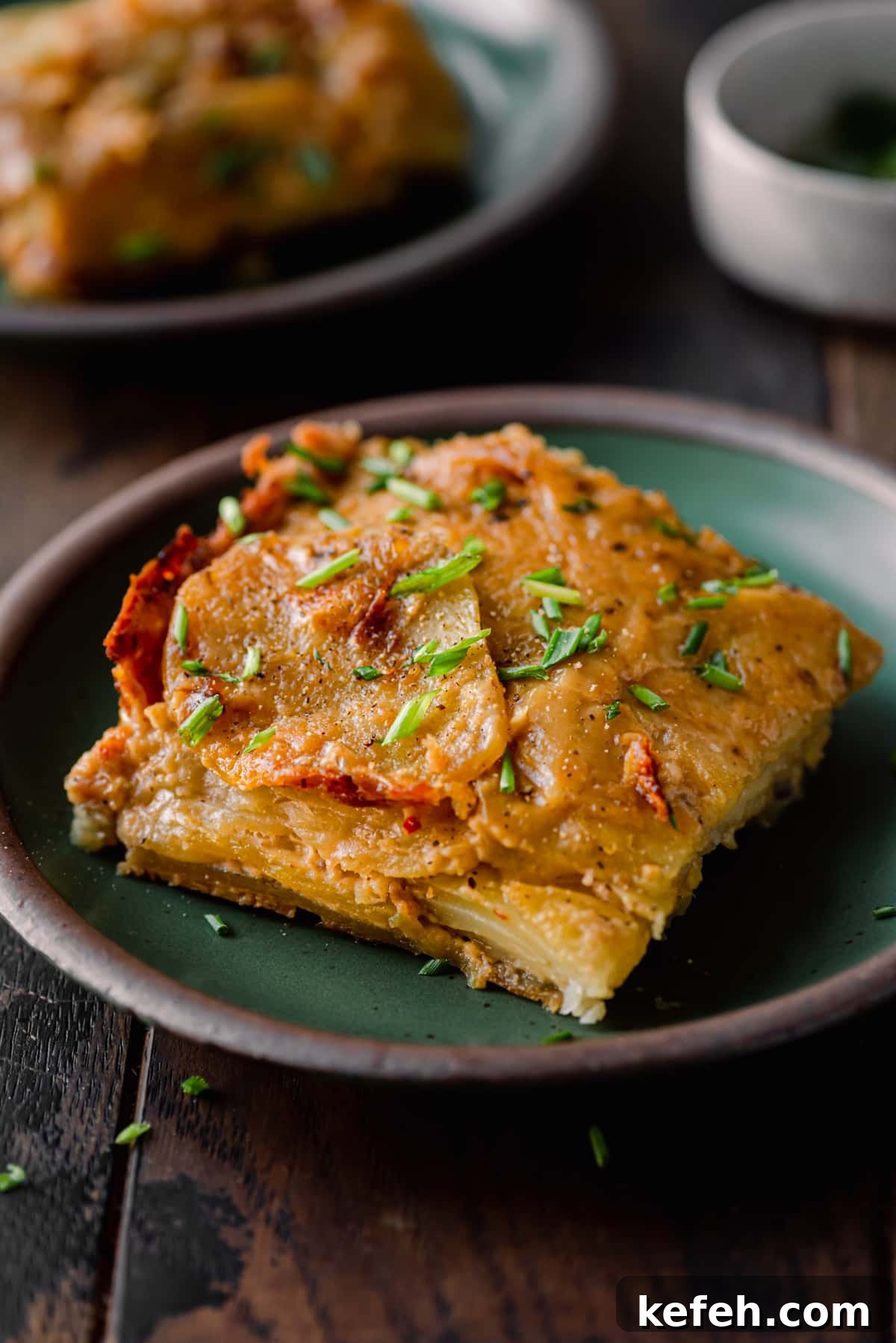 Vegan Holiday Survival Guide: Thrive at Festive Meals 11 one square of scalloped potatoes on a small plate.
